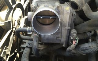 Instructions for cleaning the throttle body on a Toyota Corolla